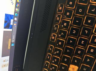 A laptop screen displaying two beige tags with strings, showing text and patterns, with browser tabs visible on top.